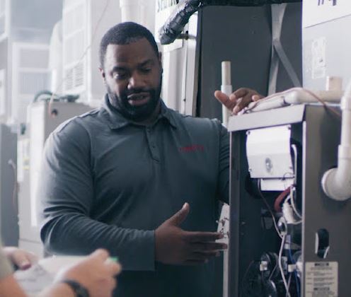 A furnace repair tech explains the components of a furnace.